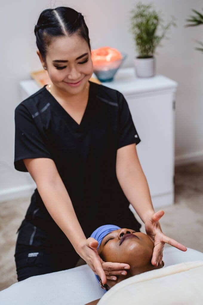 A therapist performing a massage on a client