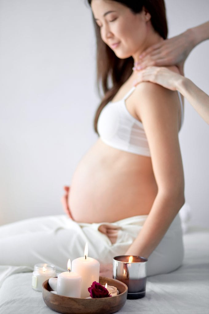 Prenatal Massage at Zen'd Out Massage Spa A pregnant woman getting a prenatal massage