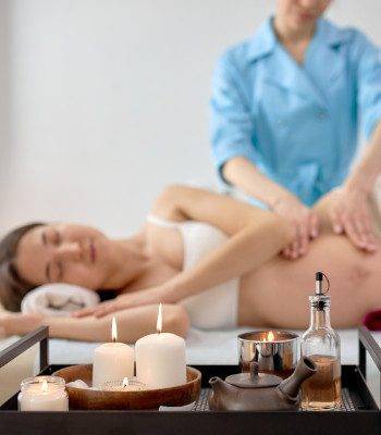 Denver Prenatal Massage at Zend Out Massage Spa A pregnant woman relaxing while getting a prenatal massage