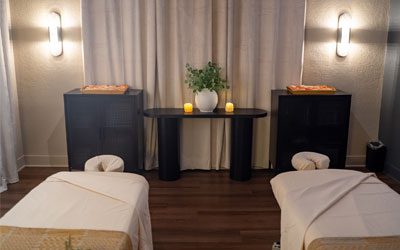 Maria-Spa5 A serene, dimly lit spa room features two massage tables