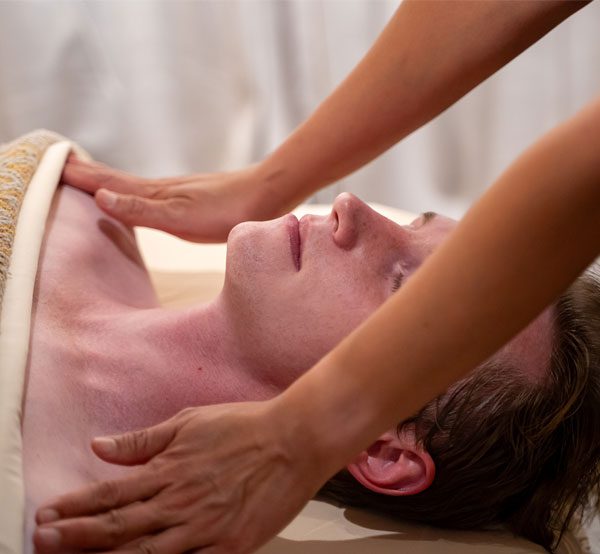 solo-spa-experience A man receiving a massage by a therapist