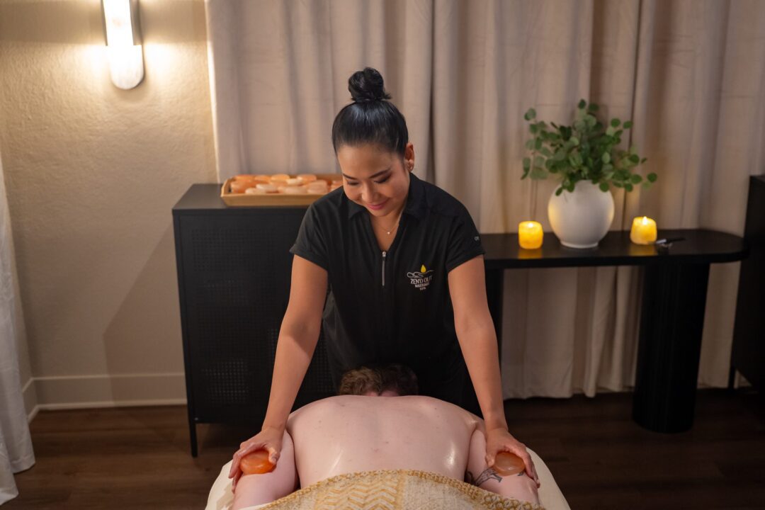 A Zen'd Out therapist giving one guest an individual massage